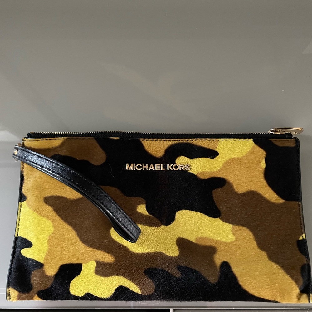Michael Kors wristlet. Cowhide material. Excellent Used Condition. Used once.